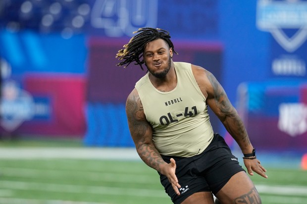 Alabama offensive lineman JC Latham runs a drill at the NFL scouting combine on March 3, 2024, in Indianapolis. (AP Photo/Darron Cummings)