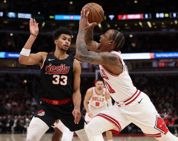 Chicago Bulls forward DeMar DeRozan (11) drives against Portland Trail Blazers forward Toumani Camara (33) in the first half Monday, March 18, 2024, at the United Center. (Brian Cassella/Chicago Tribune)