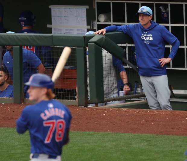 Cubs manager Craig Counsell, right, watches left fielder Owen Caissie bat in a Cactus League game against the Royals on Feb. 26, 2024, at Surprise Stadium in Surprise, Ariz. (Stacey Wescott/Chicago Tribune)