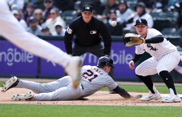 Chicago White Sox first baseman Andrew Vaughn, 25, tries to get Detroit Tigers outfielder Mark Canha out at first base during the fourth inning of the game at Guaranteed Rate Field in Chicago on March 31, 2024. (Eileen T. Meslar/Chicago Tribune)