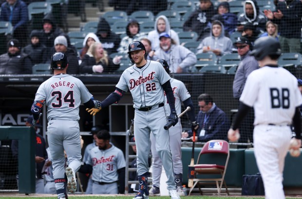 Detroit Tigers center fielder Parker Meadows, 22, high-fives catcher Jake Rogers (34) after his home run during the fifth inning of the game against the Chicago White Sox at Guaranteed Rate Field in Chicago on March 31, 2024. (Eileen T. Meslar/Chicago Tribune)