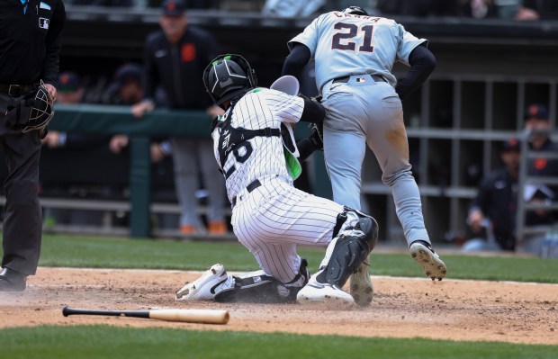 Chicago White Sox catcher Korey Lee, 26, tags Detroit Tigers outfielder Mark Canha out at home plate during the sixth inning of the game at Guaranteed Rate Field in Chicago on March 31, 2024. (Eileen T. Meslar/Chicago Tribune)