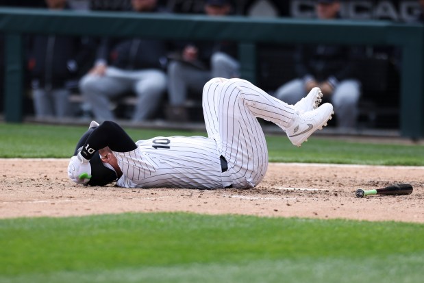 Chicago White Sox third baseman Yoan Moncada, 10, lays on the ground after injuring himself during the eighth inning of the game against the Detroit Tigers at Guaranteed Rate Field in Chicago on March 31, 2024. (Eileen T. Meslar/Chicago Tribune)