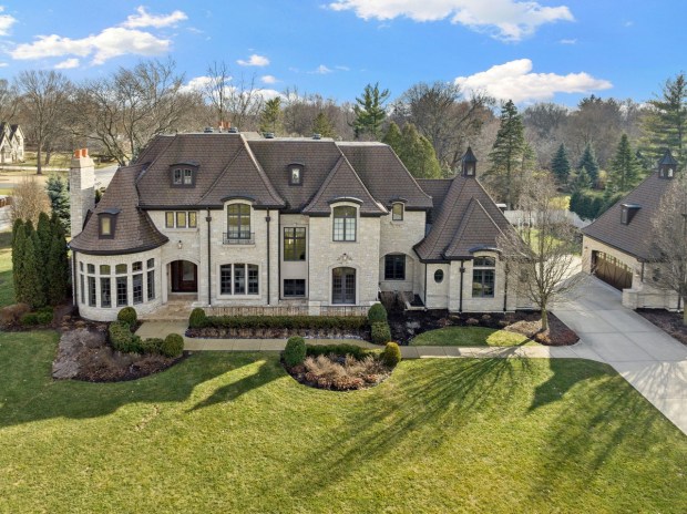 A six-bedroom French Provincial-style mansion in Wheaton was listed on March 7 for $3.59 million, and its owners are offering to receive full payment for the house in cryptocurrency. (Michael LaFido)