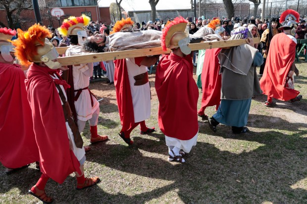 Jesus, played by Tony Diaz, is carried during the Good Friday Via Crucis procession in Chicago's Pilsen neighborhood on March 29, 2024. (Antonio Perez/Chicago Tribune)