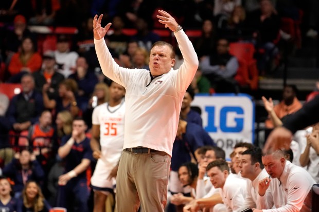 Illinois head coach Brad Underwood reacts on the bench during an NCAA college basketball game against Minnesota Wednesday, Feb. 28, 2024, in Champaign, Ill. (AP Photo/Charles Rex Arbogast)