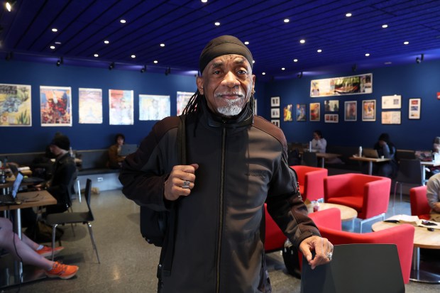 Turtel Onli with an exhibition of his art on Feb. 13, 2024, on display in the cafe at the Reva and David Logan Center for the Arts in Chicago. (Terrence Antonio James/Chicago Tribune)