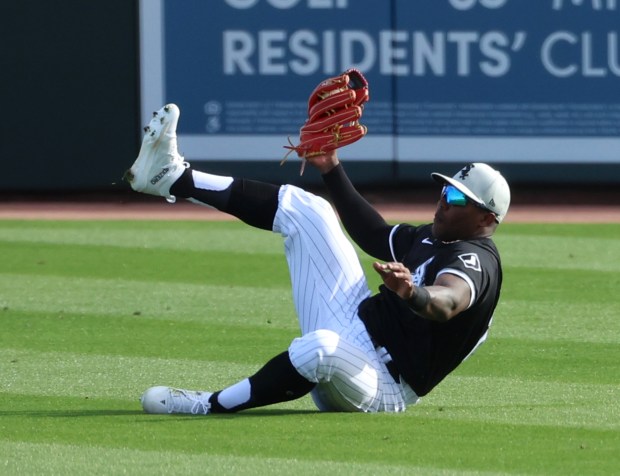 White Sox right fielder Oscar Colas robs the Mariners' Samad Taylor of a hit during a Cactus League game on Feb. 24, 2024, in Glendale, Arizona. (Stacey Wescott/Chicago Tribune)