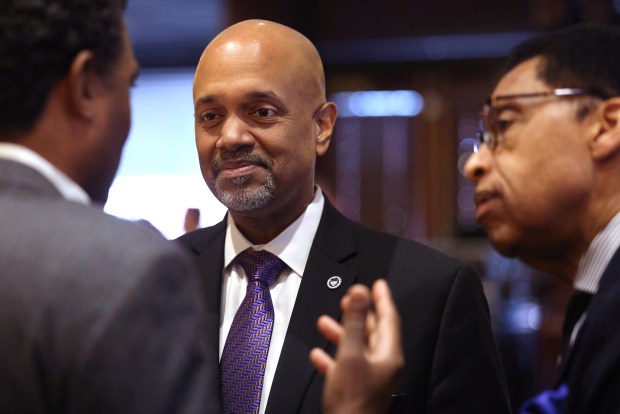 Cook County State's candidate Clayton Harris talks with guests before speaking at the City Club in Chicago on Thursday, March 7, 2024. (Antonio Perez/Chicago Tribune)