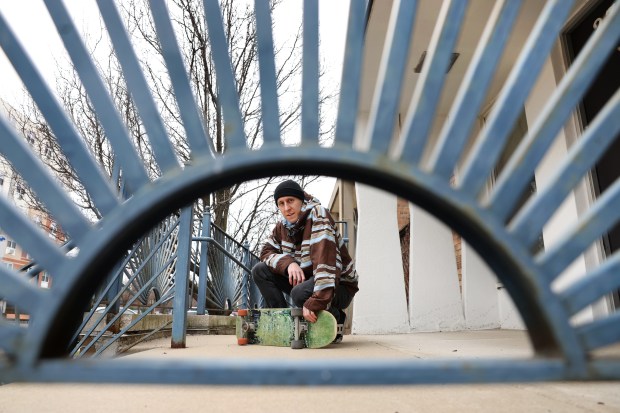 Collin Pearsall tries to live as sustainably as possible, composting food scraps, eating a low to moderate amount of meat, growing herbs on the balcony, and walking or skateboarding instead of driving. (Chris Sweda/Chicago Tribune)