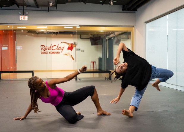 Dancers Chanelle Turnbull, left, and Rahila Coats rehearse a piece Monday, March 4, 2024, at the Red Clay Dance Company in Woodlawn. (Brian Cassella/Chicago Tribune)