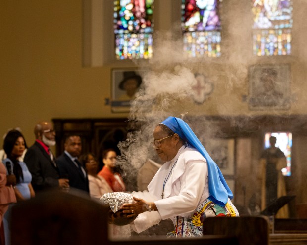 Church members conduct an Easter Mass service with Cardinal Blase Cupich on Sunday, March 31, 2024, at St. Moses the Black Parish in Grand Crossing. (Brian Cassella/Chicago Tribune)