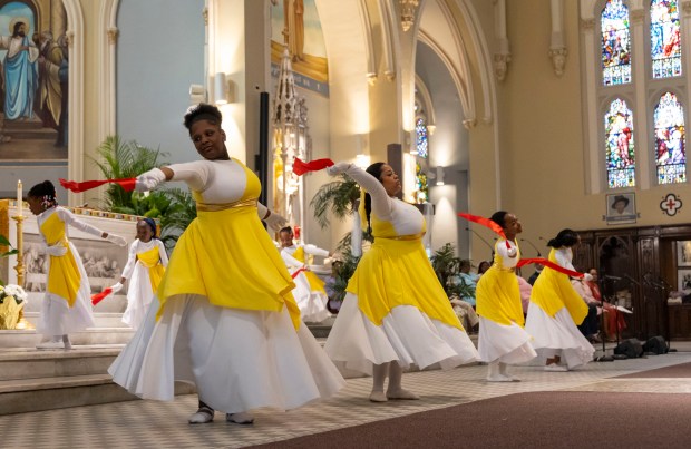 Youth members dance during an Easter Mass on Sunday, March 31, 2024, at St. Moses the Black Parish in Grand Crossing. (Brian Cassella/Chicago Tribune)