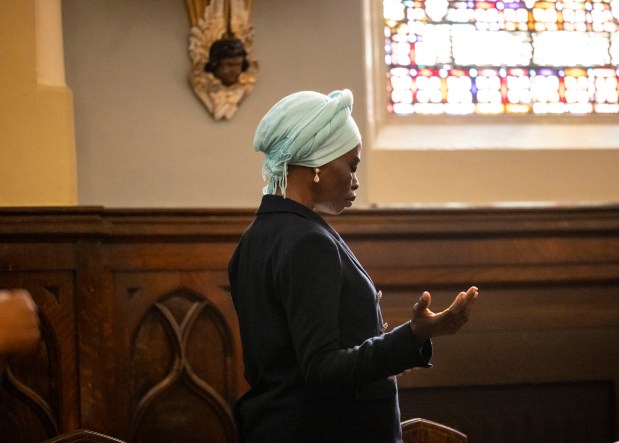 A church member prays during an Easter Mass on Sunday, March 31, 2024, at St. Moses the Black Parish in Grand Crossing. (Brian Cassella/Chicago Tribune)