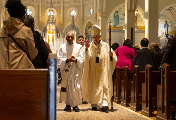 Cardinal Blase Cupich waves to church members after an Easter Mass on Sunday, March 31, 2024, at St. Moses the Black Parish in Grand Crossing. (Brian Cassella/Chicago Tribune)