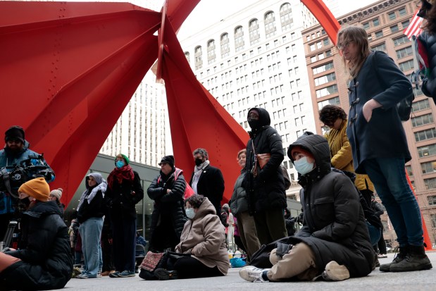 Dozens of people gather at Federal Plaza in Chicago, March 7, 2024, at the start of a 24 hour vigil to remember and call out the names of the thousands of people killed in Gaza. (Antonio Perez/Chicago Tribune)