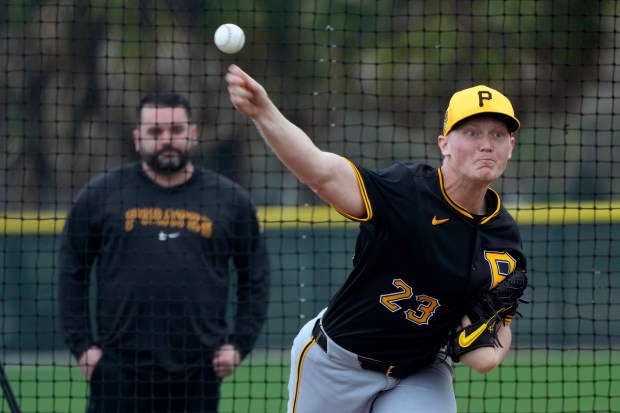 FILE - Pittsburgh Pirates starting pitcher Mitch Keller throws during a baseball spring training workout Saturday, Feb. 17, 2024, in Bradenton, Fla. The Pirates and Keller agreed to a five-year contract on Thursday worth $77 million. The deal is pending a physical, a person with knowledge of the agreement told The Associated Press Thursday, Feb. 22, 2204. The person spoke on the condition of anonymity because it was not yet final. (AP Photo/Charlie Neibergall, File)