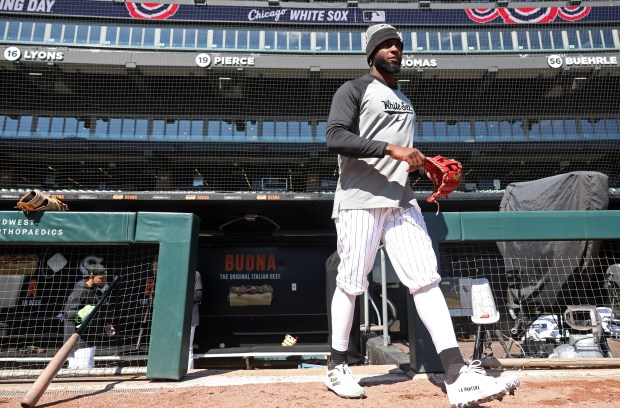 White Sox outfielder Luis Robert Jr. exits the dugout during a team workout at Guaranteed Rate Field Wednesday, March 27, 2024, in Chicago. (John J. Kim/Chicago Tribune)