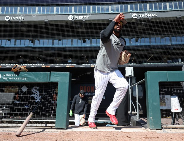 White Sox outfielder Eloy Jiménez exits the dugout during a team workout at Guaranteed Rate Field Wednesday, March 27, 2024, in Chicago. (John J. Kim/Chicago Tribune)