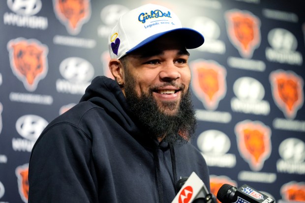 Chicago Bears wide receiver Keenan Allen smiles as he listens to reporters at a news conference at Halas Hall in Lake Forest, Ill., Saturday, March 16, 2024. A day after the Chargers released wide receiver Mike Williams, the team decided to ship star wideout Keenan Allen to the Chicago Bears in exchange for a fourth-round pick. (AP Photo/Nam Y. Huh)