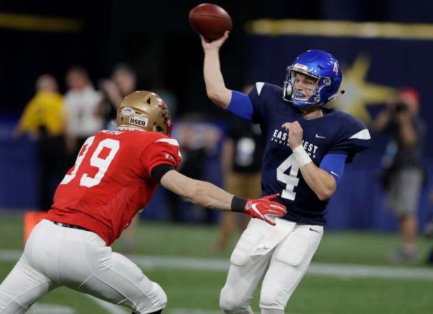 Boise State quarterback Brett Rypien throws a pass as he is pressured by Mathieu Betts during the East-West Shrine Game on Jan. 19, 2019, in St. Petersburg, Fla. (Chris O'Meara/AP)