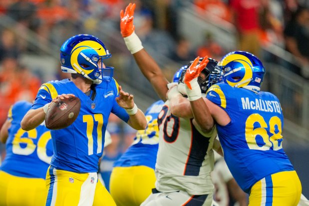 Rams quarterback Brett Rypien passes against the Broncos during a preseason game on Aug. 26, 2023, in Denver. (Jack Dempsey/AP)
