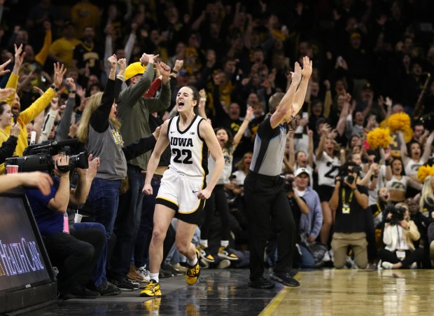 Iowa guard Caitlin Clark celebrates after breaking the NCAA women's all-time scoring record during a game against Michigan on Feb. 15, 2024, at Carver-Hawkeye Arena in Iowa City, Iowa. (Matthew Holst/Getty)