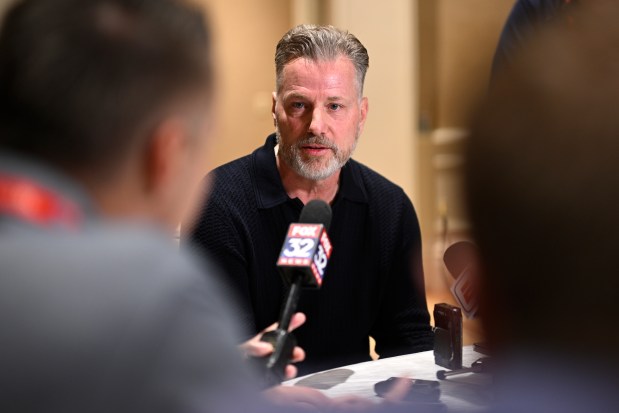 Chicago Bears head football coach Matt Eberflus, center, talks with reporters during an NFC coaches availability at the NFL football owners meetings, Tuesday, March 26, 2024, in Orlando, Fla. (AP Photo/Phelan M. Ebenhack)