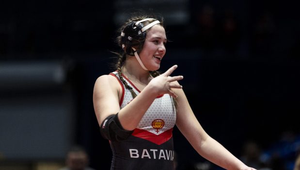 Batavia's Sydney Perry signals four titles after beating Goreville's Alivia Ming in the girls wrestling championship match at 145 pound at Grossinger Motors Arena in Bloomington on Saturday, Feb. 24, 2024. (Vincent D. Johnson / Daily Southtown)