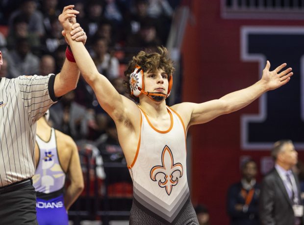 St. Charles East's Ben Davino's celebrates after his win against Hononega's Thomas Silva during the 132 pound bout in the class 3Astate wrestling championship at the State Farm Center at University of Illinois in Champaign on Saturday, Feb. 17, 2024. (Vincent D. Johnson / Daily Southtown).