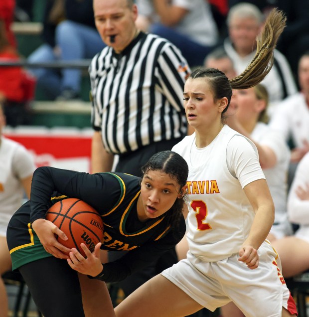 Fremd's Coco Urlacher (11) grabs the ball away from Batavia's Brooke Carlson (2) in the fourth quarter during the Class 4A Bartlett Supersectional on Monday, Feb. 26, 2024 in Bartlett. Batavia fell 65-46. H. Rick Bamman / For the Beacon-News