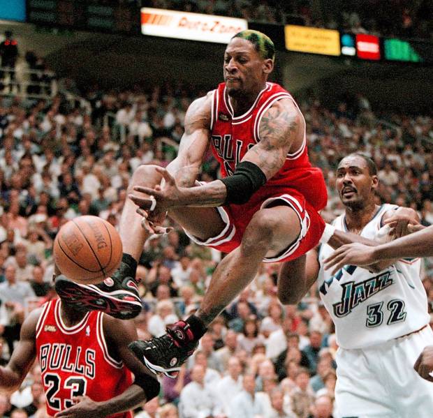 Bulls forward Dennis Rodman pounces for a rebound during Game 2 of the 1998 NBA Finals. (Nuccio DiNuzzo/Chicago Tribune)