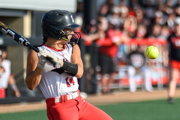 Marist's Caroline O'Brien (14) pulls back on a close pitch against Yorkville during the Class 4A state championship game at the Louisville Slugger Sports Complex in Peoria on Saturday, June 10, 2023.