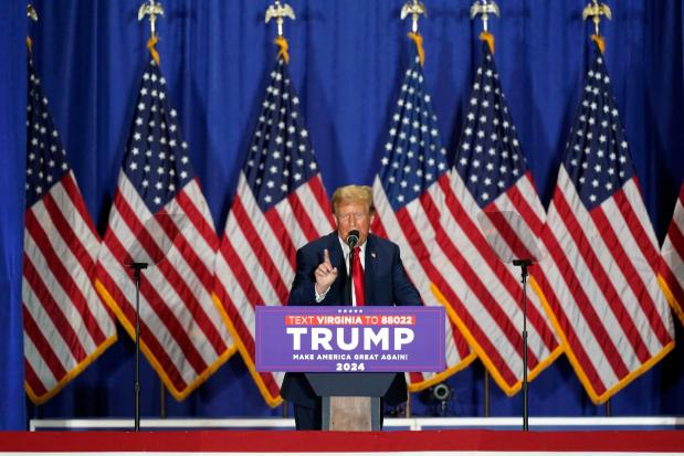 FILE - Republican presidential candidate former President Donald Trump speaks at a campaign rally, March 2, 2024, in Richmond, Va. A lawsuit settlement offers new details about how two attorneys for former President Donald Trump orchestrated a plan for fake electors to file paperwork falsely saying the Republican won Wisconsin in a strategy to overturn Democrat Joe Biden's 2020 victory there and in other swing states. The agreement settles a civil lawsuit filed by Democrats against the attorneys and the fake electors. (AP Photo/Steve Helber, File)