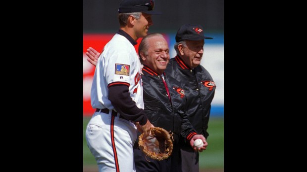 Orioles vs. Kansas City for Opening Day baseball as Cal Ripken, Peter Angelos, and then-Gov. William Donald Schaefer pose for a picture after throwing out the first pitch.