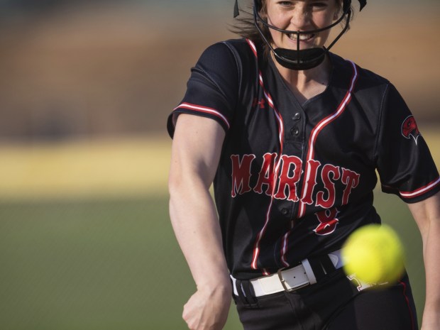 Marist's Gianna Hillegonds (8) delivers a pitch against Joliet Catholic during an East Suburban Catholic Conference game in Joliet on Monday, April 24, 2023.