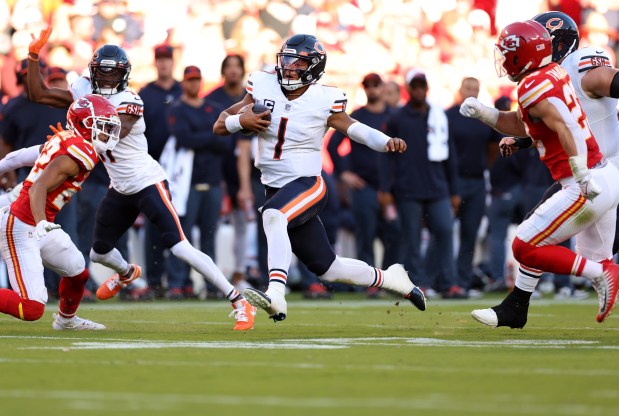 Bears quarterback Justin Fields scrambles in the third quarter of a game against the Chiefs at Arrowhead Stadium on Sept. 24, 2023.