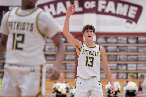 Stevenson's Jack Dabbs (13) celebrates a three point shot against Palatine during the boys Class 4A Elgin Sectional championship game on Friday, March 1, 2024. Stevenson lost 46-38 to Palatine. (Mark Black / News-Sun)