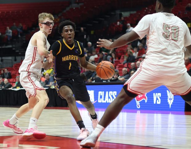 Warren Township's Jaxson Davis (1) drives to the basket during the Class 4A NIU Super-Sectional against Palatine at NIU Convocation Center in DeKalb on Monday, March 4, 2024. (Troy Stolt/for the News-Sun)