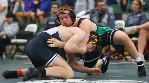 Grayslake Central's Matty Jens and Fenwick's Patrick Gilboy wrestle during the 175-pound 1st place match in the Class 2A Grayslake Central Sectionals in Grayslake on Saturday Feb. 10, 2024. (Troy Stolt for the News-Sun)