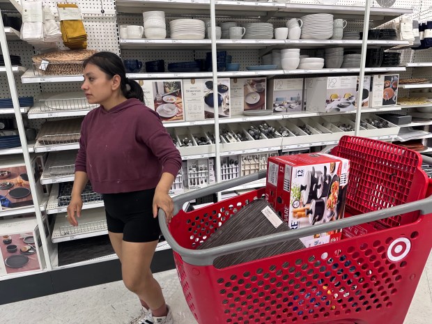 Doralyd Hernandez, a mother of three, shops at Target on March 12, to replace everyday items the family lost when a tornado struck her Mundelein apartment complex on Feb. 27. (Yadira Sanchez Olson/Lake County News-Sun)