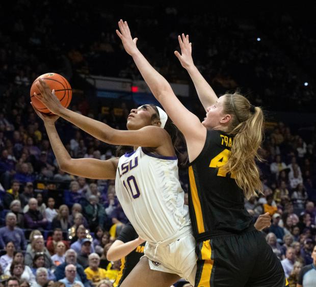 FILE - LSU forward Angel Reese (10) drives past Missouri forward Hayley Frank (43) during an NCAA college basketball game Thursday, Jan. 4, 2024, in Baton Rouge, La. As March Madness is set to tip off, three of the most recognizable names in college basketball are in the women's tournament: Caitlin Clark, Angel Reese and Paige Bueckers.(Hilary Scheinuk/The Advocate via AP, File)