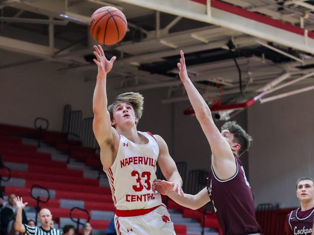 Naperville Central's Ross DeZur (33) shoots a layup during a game against Lockport in Naperville on Saturday Jan. 6, 2024. (Troy Stolt for the Naperville Sun)