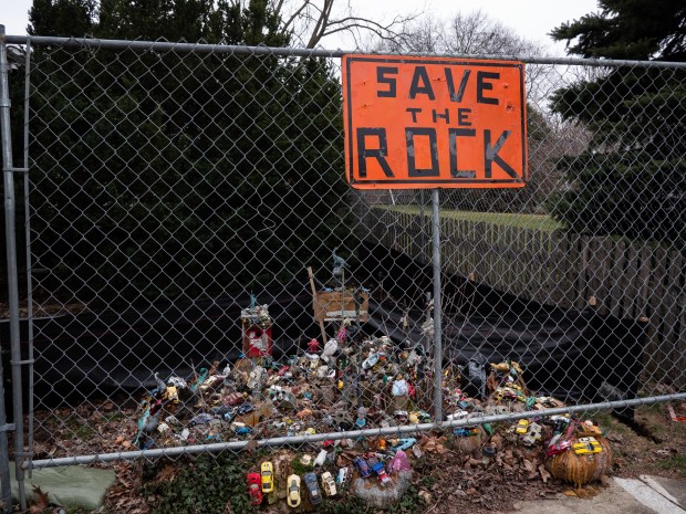 A sign to "Save the Rock" has been placed in front of the property at 711 N. Brainard St. in Naperville as a developer prepares to tear down the house there and building something new. (Tess Kenny/Naperville Sun)