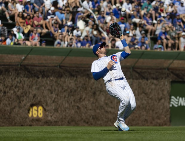 Cubs left fielder Ian Happ makes a catch in the eighth inning during a game on April 12, 2023, at Wrigley Field.