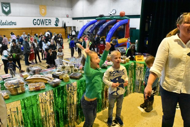 Finn Tagmeier cheers after winning some cookies at a cakewalk Friday night at the Gower Fun Fair. (Jesse Wright)