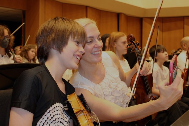 Evanston mother and son team Caroline and Gus Moyer perform together for the first time during the Young Persons' Concert at Pick-Staiger Concert Hall in Evanston on March 9. Photo by Gina Grillo.