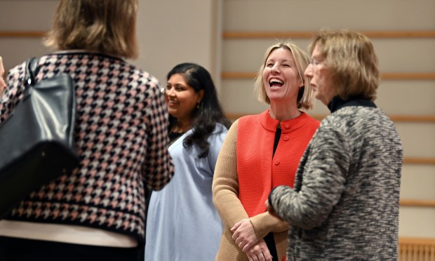 Third from left, Katie Degen of Wilmette, owner of Central Station Coffee & Tea in Wilmette is a panelist talking with attendees before the Women in the Workplace program at the Wilmette Public Library Auditorium in Wilmette on March 13, 2024. (Karie Angell Luc/for the Pioneer Press)