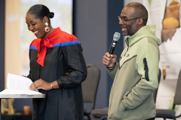 Pastor Curtis Whittaker, of Faith Farms in Gary, on right, speaks as Feeding America Food Security Equity Impact Fund director Mya Price looks on during the Black Loam Conference in Merrillville on Thursday, March 28, 2024. (Kyle Telechan/for the Post-Tribune)