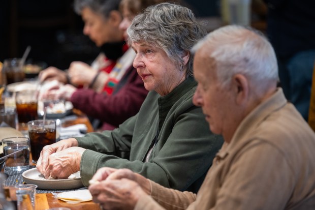 Detroit-area tour operator Sue Biggs, who works with Custom Holidays, folds her own empanada during a demonstration at Provecho latin Provisions as part of the Heartland Familiarization tour in Crown Point on Tuesday, March 5, 2024. (Kyle Telechan/for the Post-Tribune)